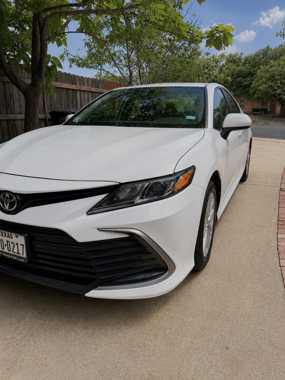 White Toyota Camry sedan freshly detailed