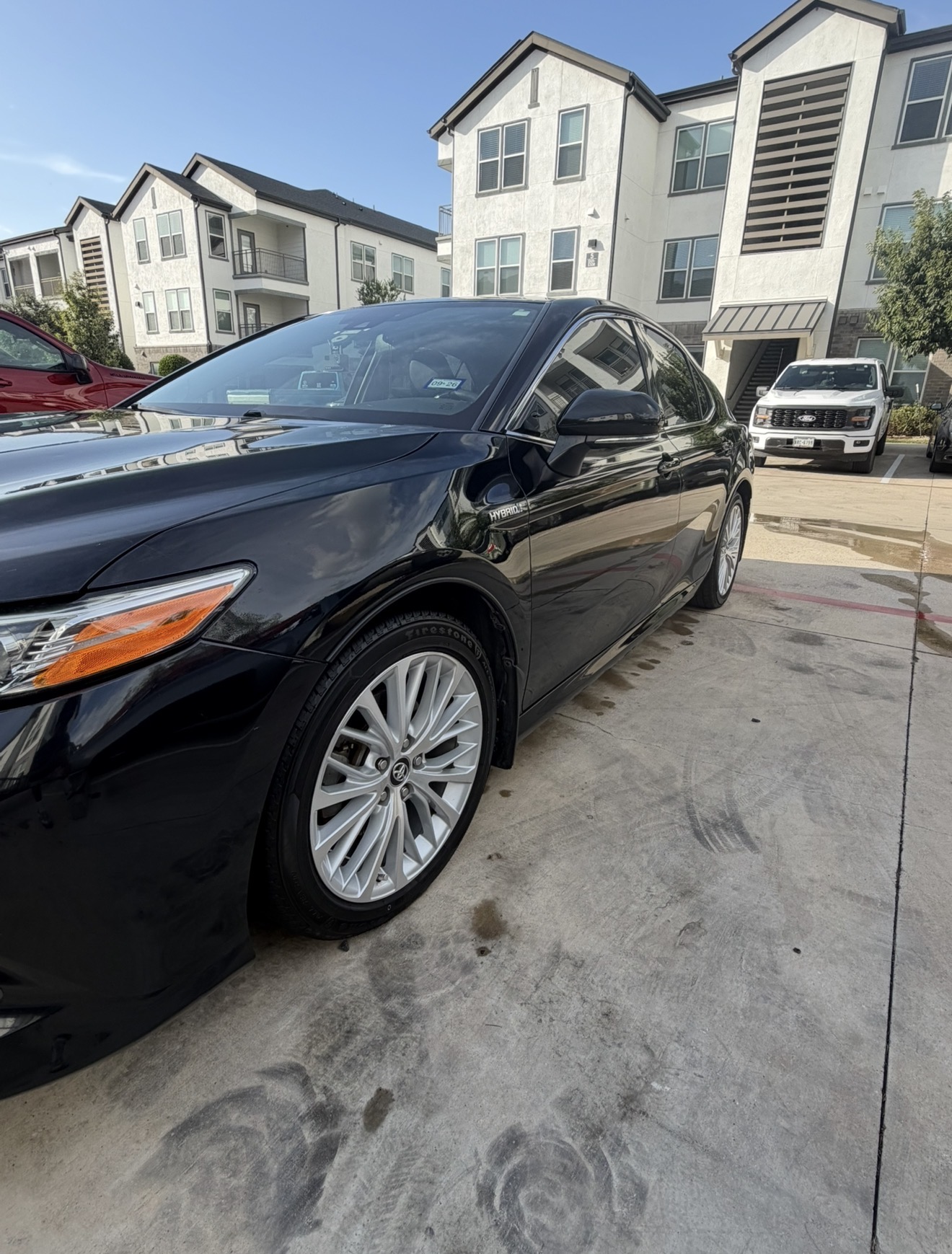 Black Toyota Camry sedan after a mobile detail